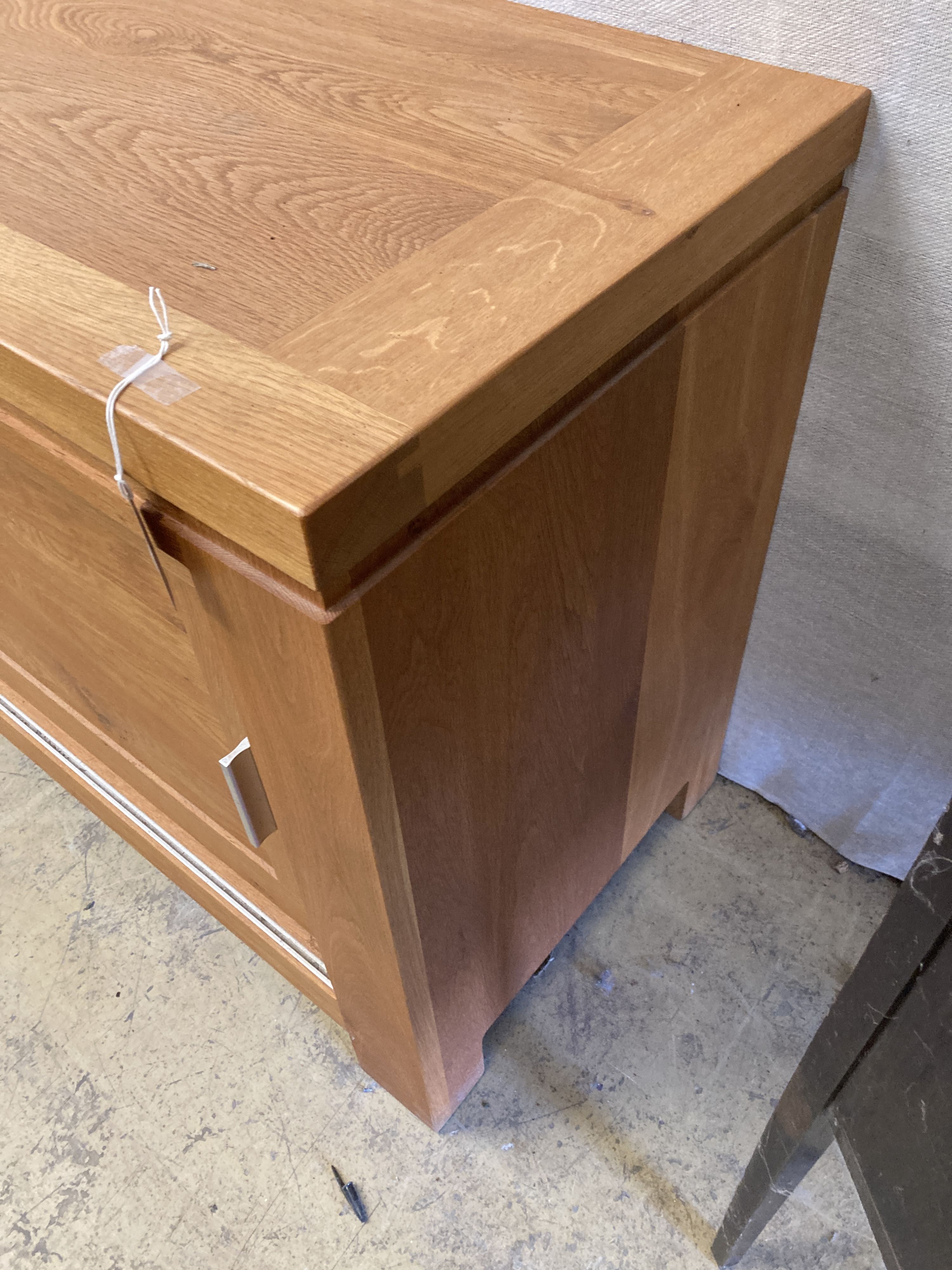 A contemporary light oak sliding door sideboard, length 178cm, depth 50cm, height 78cm